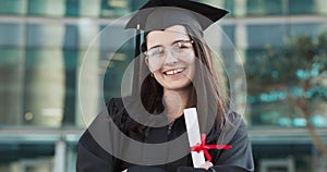 Face, diploma and woman in laughter by graduation, happy and student achievement of university degree on campus. Young