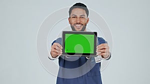 Face, doctor and man with a tablet, green screen and healthcare on a white studio background. Portrait, medical