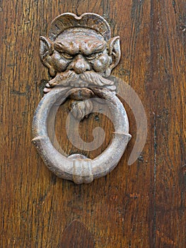Face door-knocker