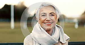 Face, elderly woman and happy on park bench on vacation, holiday or travel in winter. Portrait, smile and senior person