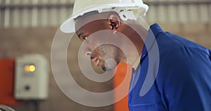 Face, engineer and black man construction worker in a warehouse closeup for manufacturing or production. Safety