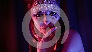 face of exotic go-go dancer in nightclub, shiny make-up with crystal, artistic image for performance