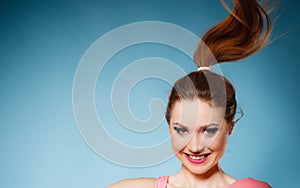 Face expression of funny teen girl on blue