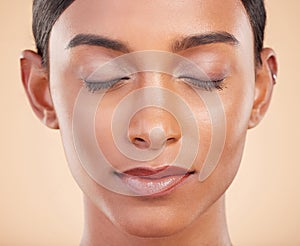 Face, eyes closed or make up on model woman in studio isolated on beige background for skincare. Facial headshot