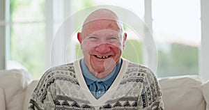 Face, funny and senior man on sofa in home living room, lounge or apartment for retirement. Portrait, laughing elderly