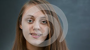 face girl a close-up. portrait lifestyle of a teenager girl smiling beautiful eyes blonde at home indoors. face of a