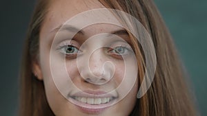 face girl a close-up. portrait of a teenager girl smiling beautiful eyes blonde lifestyle at home indoors. face of a