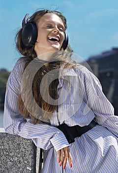 Face of girl with head-phones photo