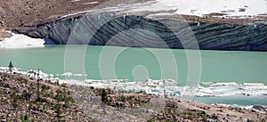 The face of a glacier showing striations