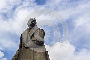 Face of granite statue of leader of world proletariat Vladimir Lenin