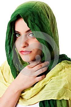 Face with green eyes and scarf