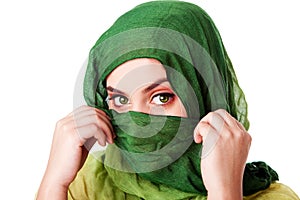 Face with green eyes and scarf