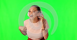 Face, green screen and woman with headphones, listen and communication against a studio background. Portrait, female