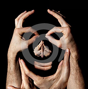 Face hands concept. Realty manipulation illusion. Black background