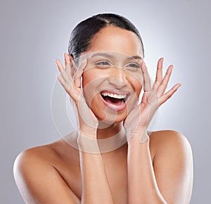 Face, hands and woman in studio for skincare with glowing, smooth and clear facial. Female model, beauty and natural