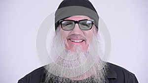 Face of happy mature bearded hipster man with sunglasses smiling