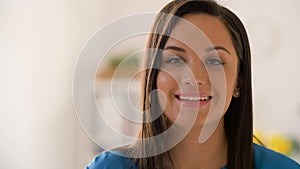 Face of happy smiling young woman