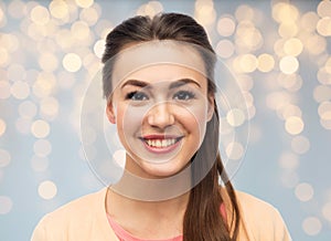 Face of happy smiling young woman