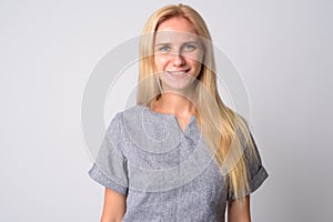 Face of happy young beautiful blonde woman smiling