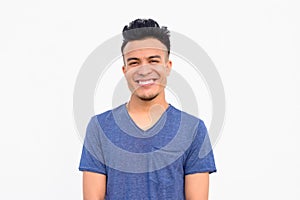 Face of happy young handsome multi ethnic man smiling against white background