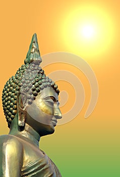 Face and head of golden green Buddha statue