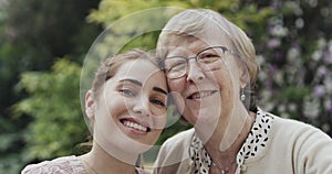 Face, heart hands and senior mother and daughter smile, bonding or care outdoor. Hand gesture, love and elderly mom with