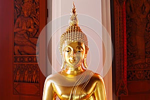 Face image of Golden Buddha statue at Thai temple