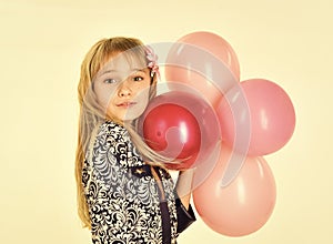 Face kid for magazine cover. Girl kids face portrait in your advertisnent. Small girl child with party balloons