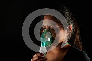 Face of latin woman with inhale mask