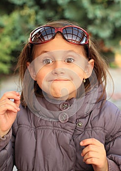 Face of little girl with glasses