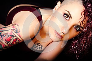 Face makeup and tattoos, punk girl make-up. Hair shaved photo
