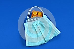 Face mask in the form of a bag with antibiotic pills