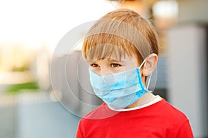 Face mask for protection coronavirus outbreak. Boy with protection facemask. Coronavirus quarantine. Health care