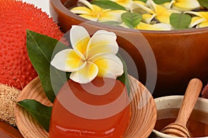 Face mask and soap with gac fruit extract and honey spa treatment concept.