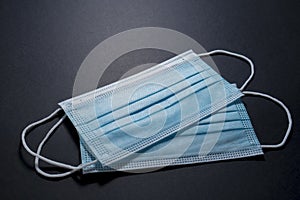 Face masks for virus protection on black background photo