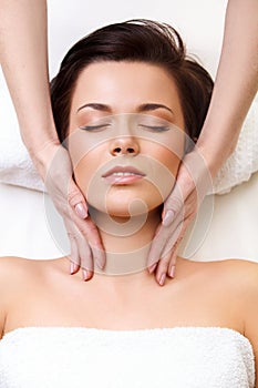 Face Massage. Close-up of a Young Woman Getting Spa Treatment.