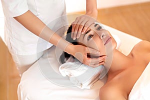 Face Massage. Close-up of a Young Woman Getting Spa Treatment.