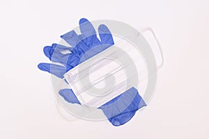 Face medical mask and blue nitrile gloves for the prevention of disease transmission, PPE personal protective equipment