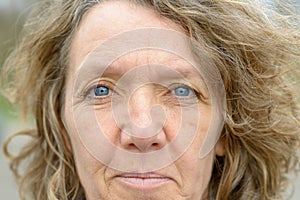 Face of middle aged woman with blue eyes