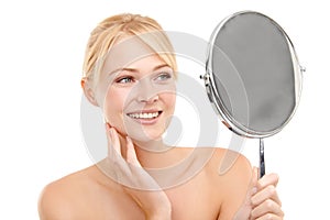 Face, mirror and woman with beauty for natural skincare and wellness on white background. Reflection, vanity and