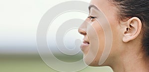 Face, mockup or hearing aid and a sports woman outdoor with an implant for sound or audio improvement. Profile, deaf and