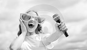Face the music happy childhood. happy girl enjoy the moment. Have Fun on Celebration. teen kid singing with microphone