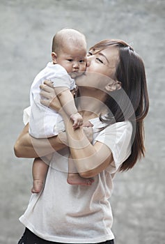 Face of newborn infant with mom use for baby and motherhood heal