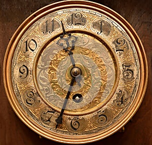 Face of the old gilded clock