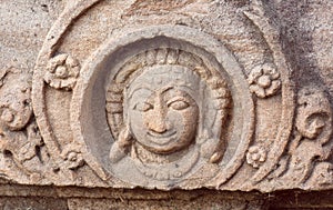 Face of one of the Hindu gods of temple, India. Example of Indian architecture in Pattadakal, UNESCO World Heritage site