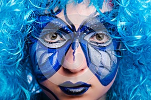 The face paint of woman with butterfly