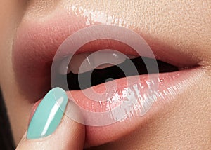 Face part. Beautiful female lips with natural makeup, clean skin. Macro shot of female lip, clean skin. Fresh kiss. Spa beauty cos