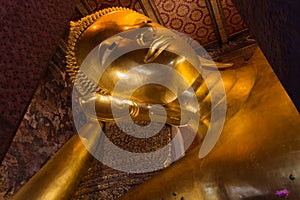 Face Part Of gold buddha statue in wat pho royal temple in thailand