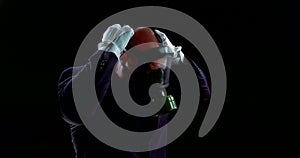 Face of a person in a business suit wearing a gas mask on a black background that protects against infection.