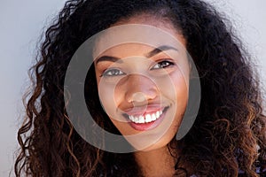 Face portrait of beautiful young black woman smiling